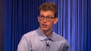Drew Basile looks at Ken Jennings with a surprised look after winning a tie-breaker on Jeopardy! on June 21, 2024.