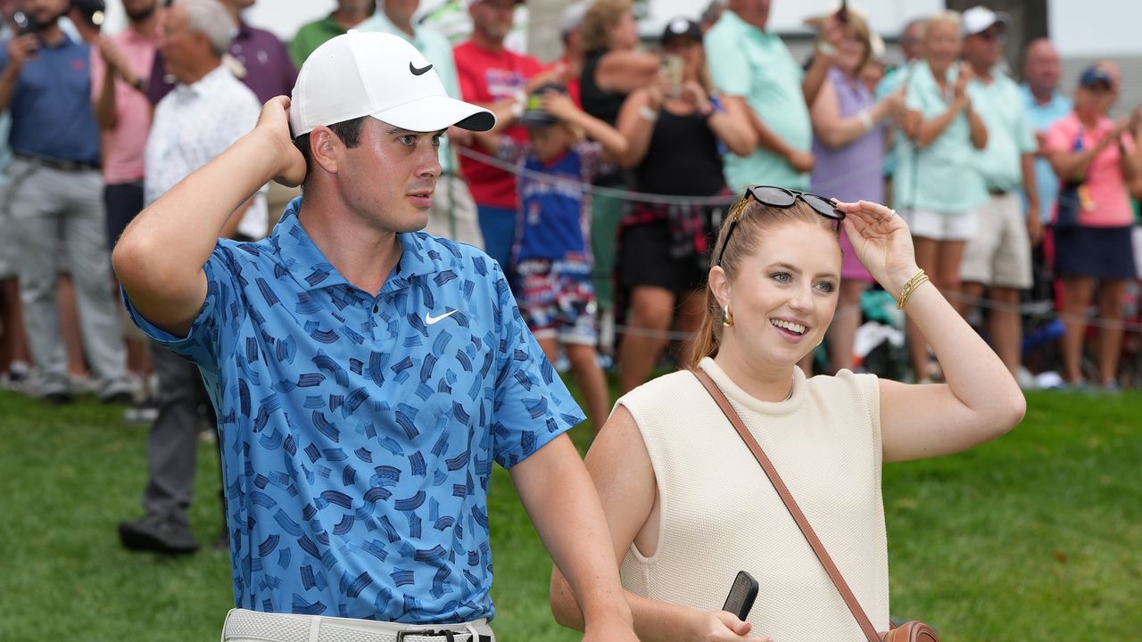 Davis Thompson and his wife Holly Grace Robinson after he won the 2024 John Deere Classic