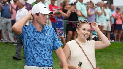 Davis Thompson and his wife Holly Grace Robinson after he won the 2024 John Deere Classic