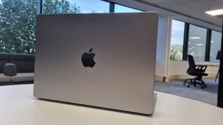 MacBook Pro 14-inch on a table in an office