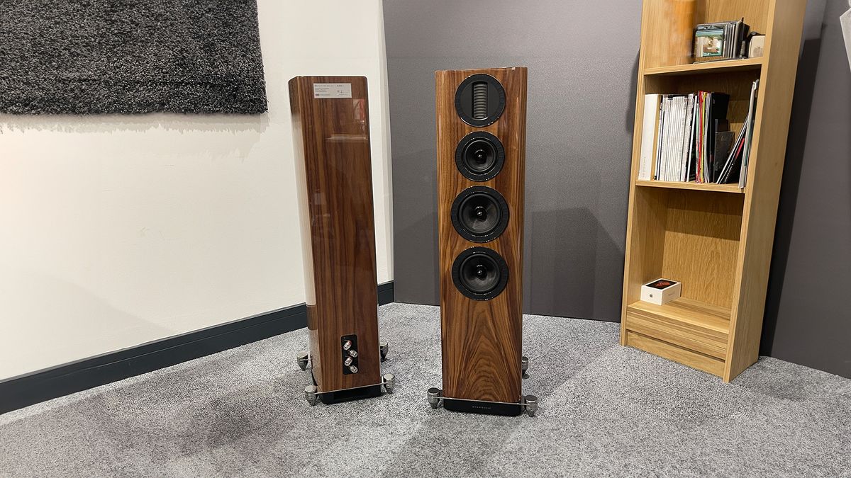  Wharfedale Aura 3 floorstanding speakers in test room on grey carpet next to bookshelf