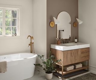 Bathroom in Shoji White by Sherwin Williams with a brown feature wall behind the sink