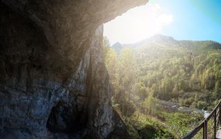 The mysterious Denisovans are known only from molars and a finger bone that were unearthed in the Denisova Cave (shown here) in the Altai Mountains in Siberia.