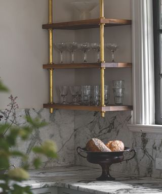 grey marble kitchen corner with open wooden shelving