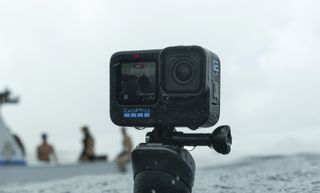 GoPro Hero 12 Black on a mount above the ocean surface with boat in the background