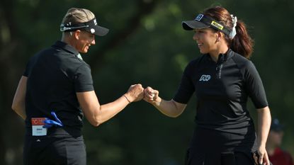 Georgia Hall of England (right) celebrates with teammate Ryann O'Toole after putting in for a birdie on the 12th green during Day Two of the Dow Great Lakes Bay Invitational 