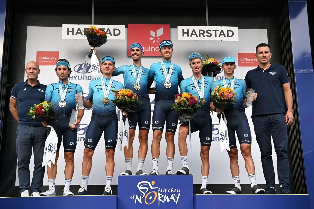 HARSTAD NORWAY AUGUST 08 Samuele Battistella of Italy Gleb Brussenskiy of Kazahkstan Stefan De Bod of South Africa Fabio Felline of Italy Yevgeniy Gidich of Kazahkstan Benjamin Perry of Canada and Team Astana Premier Tech celebrate at final podium as best team during the 8th Arctic Race Of Norway 2021 Stage 4 a 1635km stage from Gratangen to Harstad 54m ArcticRace on August 08 2021 in Harstad Norway Photo by Stuart FranklinGetty Images