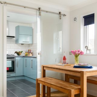 kitchen with blue coloured and glass door