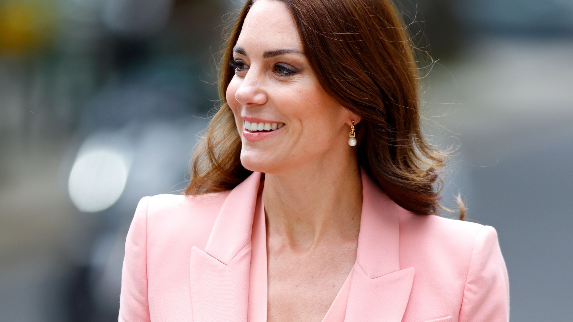 In a rare display, Kate Middleton wore a bright orange…