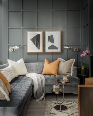 A gray living room with yellow pillows