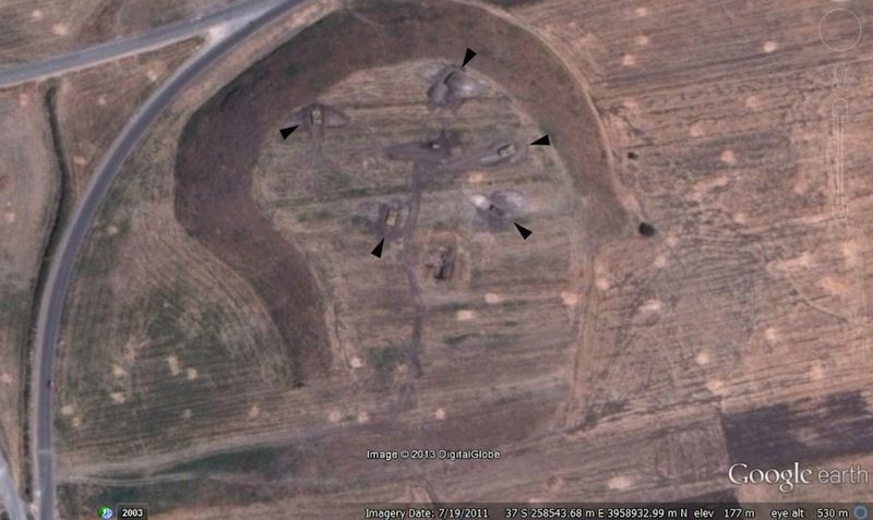 Military tanks can now be seen inside bunkers carved into the ancient mound called Tell Qarqur in Syria. The mound was once the site of an archaeological expedition. 