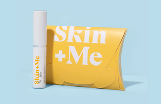 Yellow Skin+Me skincare box on blue background