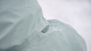 Close up of Montane logo on hood of waterproof jacket