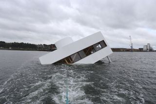 ‘Flooded Modernity’ by Asmun Havsteen-Mikkelsen being towed into position