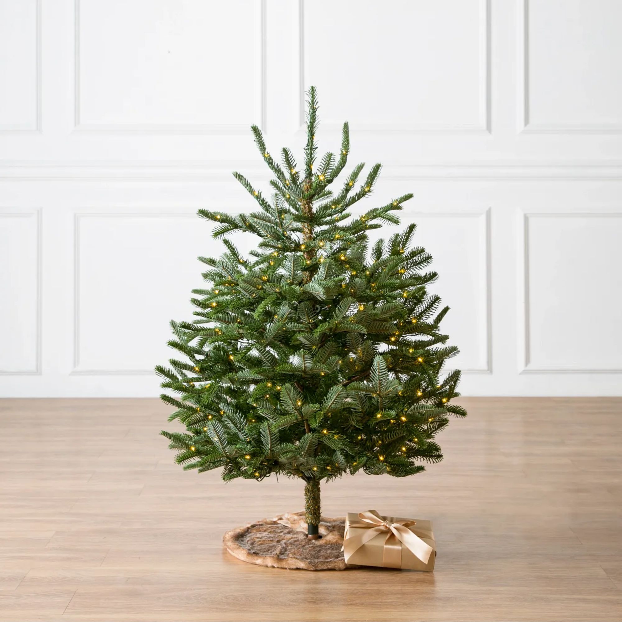 Pre-lit tabletop tree with circular wooden base