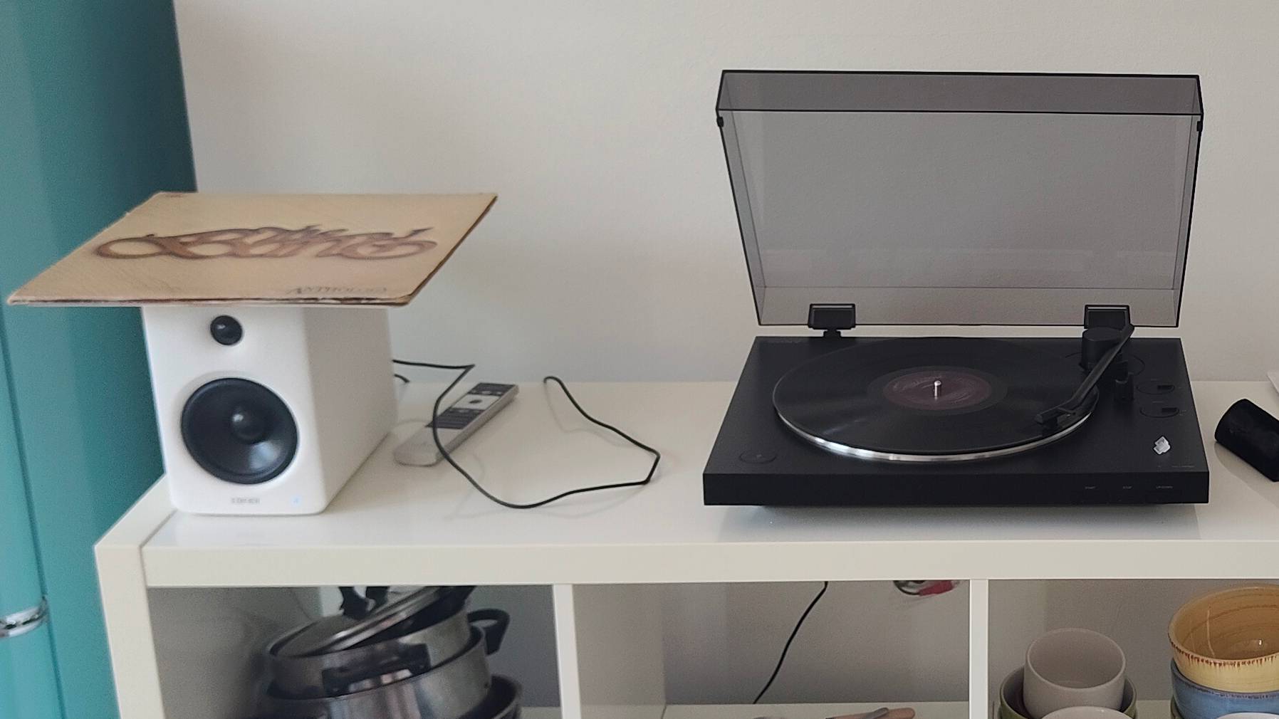 The Sony PS-LX310BT and Edifier M90 on a shelf.