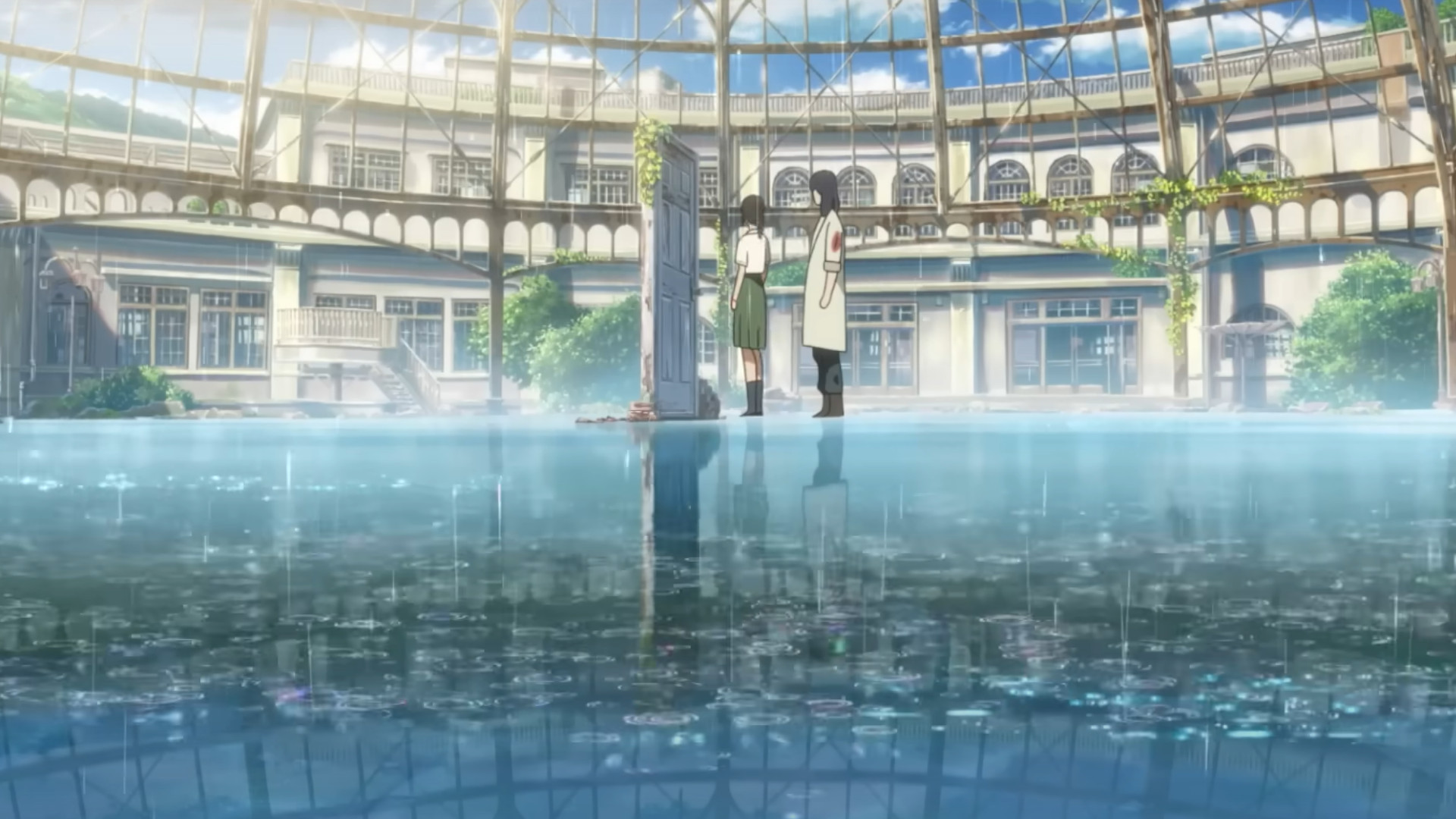 Suzume and Souta Munakata standing on water in front of a magic door during the anime movie Suzume.