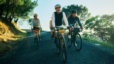 Image of four women laughing while enjoying a gravel ride