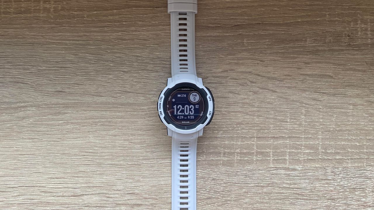 Garmin Instinct 2S laid flat on wooden surface
