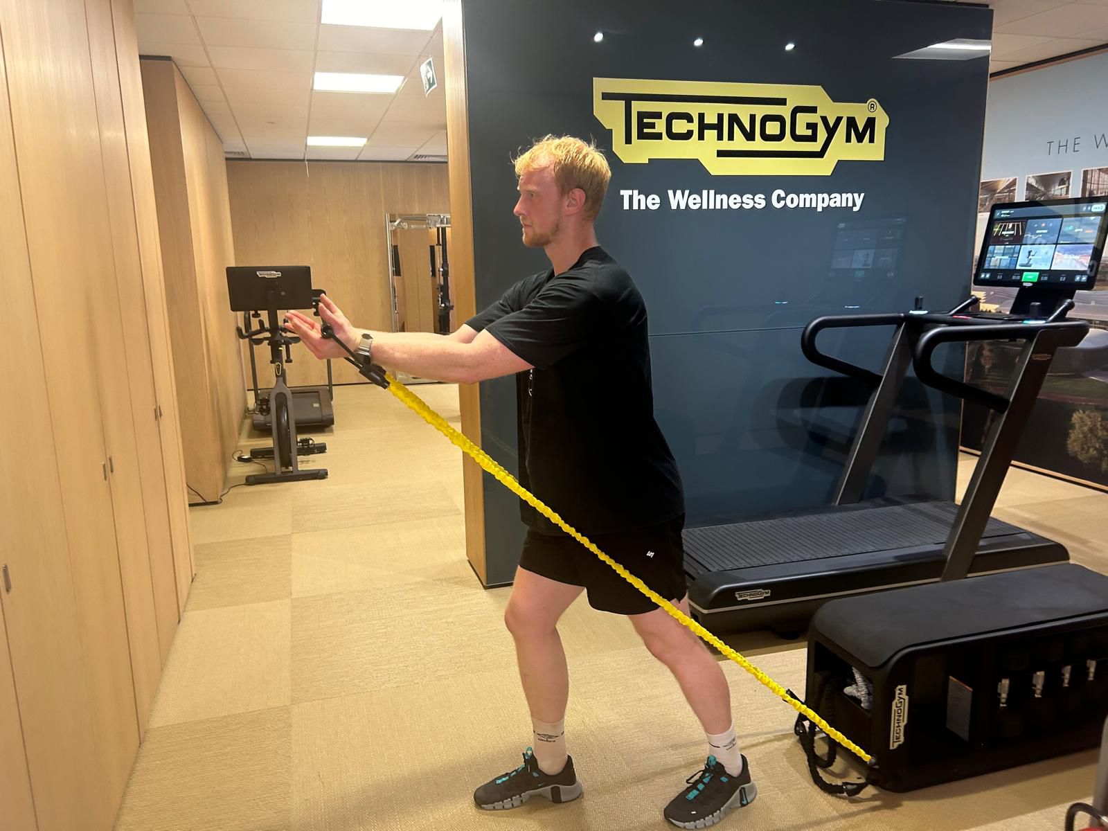 TechRadar fitness writer Harry Bullmore trying the Technogym Bench