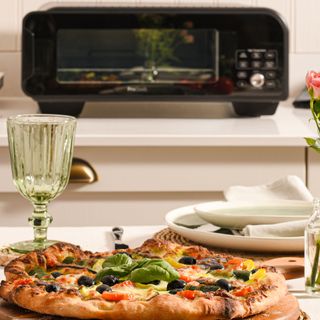 Electric pizza oven on kitchen counter