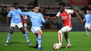 BOREHAMWOOD, ENGLAND - NOVEMBER 03: Amario Cozier-Duberry of Arsenal takes on Ezra Carrington of Man City during the PL2 match between Arsenal U21 and Manchester City U21 at London Colney on November 03, 2023 in Borehamwood, England. (Photo by David Price/Arsenal FC via Getty Images)