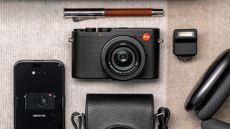 Flat lay of the Leica D-Lux 8 on desk