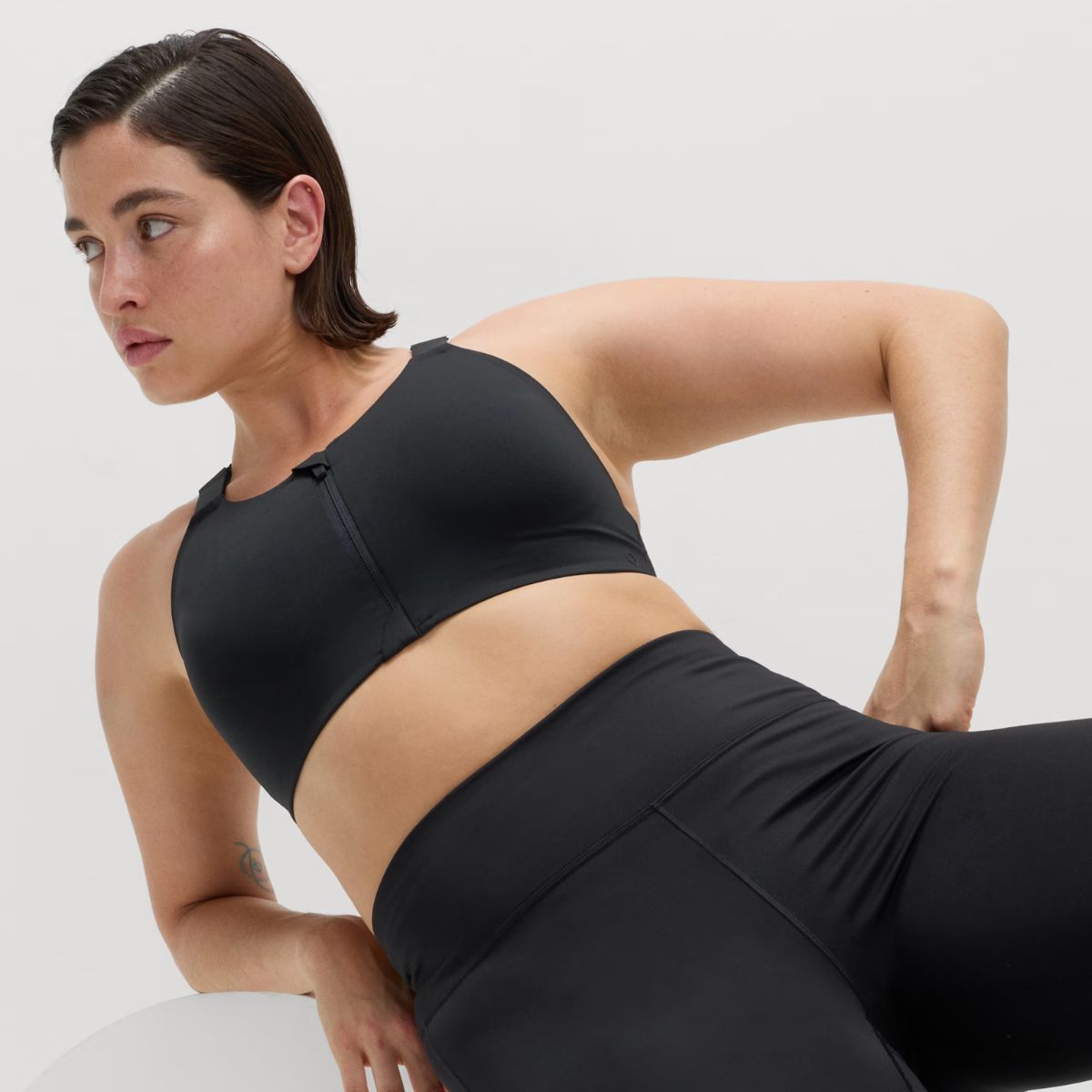 Best sports bras for big boobs: M&amp;S model wearing goodmove black bra