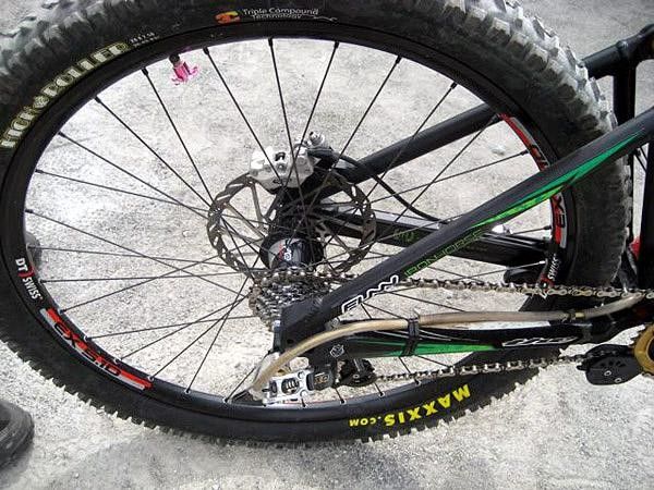 The rear derailleur housing is heavily armored to protect against damage.