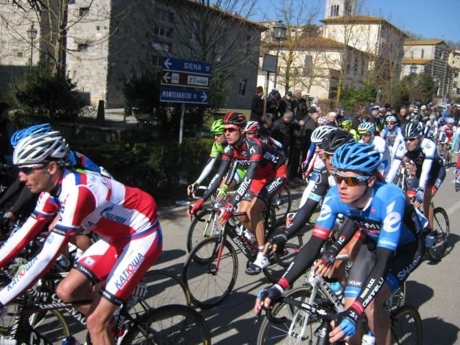 The Strade Bianche peloton rolls out of Gaiole in Chianti