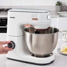 Image of Breville HEATSOFT stand mixer in promo shot on marble countertop 