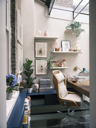 A home office with decorated open shelves