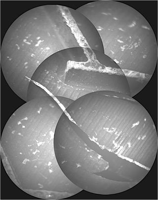 Curiosity's ChemCam remote microscopic-imager has taken images of a damaged area of the rover’s middle right-wheel. According to a team of researchers, the image shows not only a large crack in the wheel but also a pattern of distributed sub-millimeter sized blisters in the vertical wall of the T-print of the wheels which cannot be attributed to rock scratching. They suggest corrosive interaction of brines with spacecraft materials may be at work.