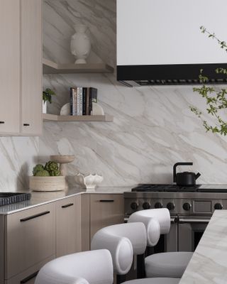 A neutrally decorated kitchen with a marble backsplash