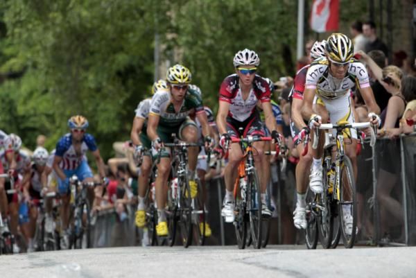 The men's peloton hears the roar of the crowd on the Manayunk Wall.