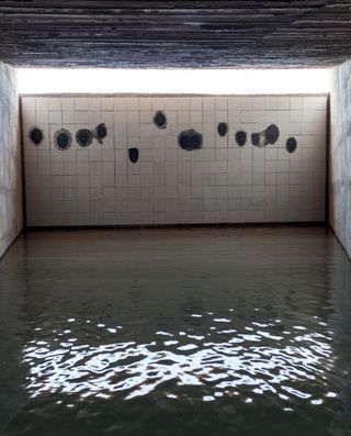 Vital’s ‘The Last Supper’, on ceramic panel, is installed on the far wall of the chapel, which is flooded in homage to the Philippine rice fields