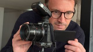 Canon pro James Paterson inspects the LCD on the back of his EOS RP to make sure the exposure looks good