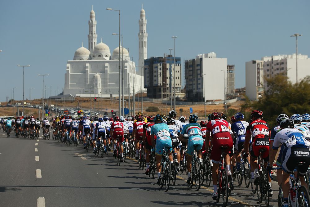 The peloton passes through the outskirts of Muscat during stage two of the 2016 Tour of Oman