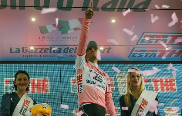 Race leader Alberto Contador points to the sky in honour of Xavier Tondo.