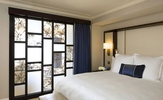 hotel bedroom with white bedding