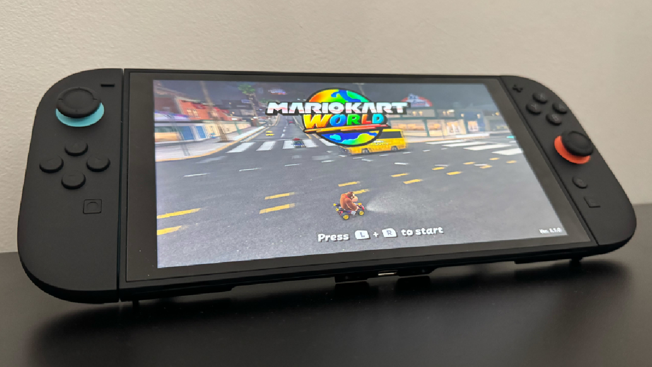 A Nintendo Switch 2 sitting on a table, with Mario Kart World on screen