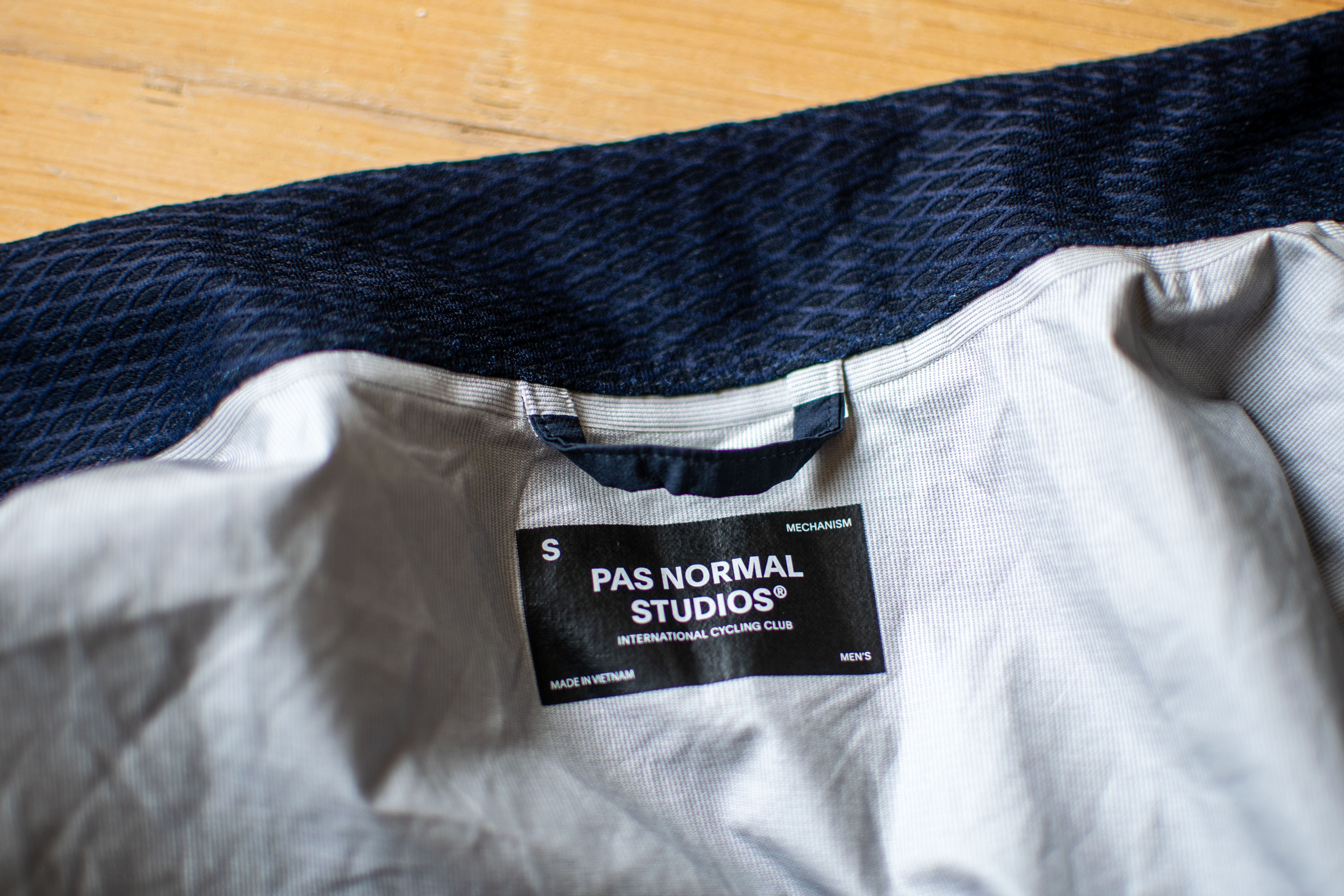 A man wearing a blue Pas Normal waterproof
