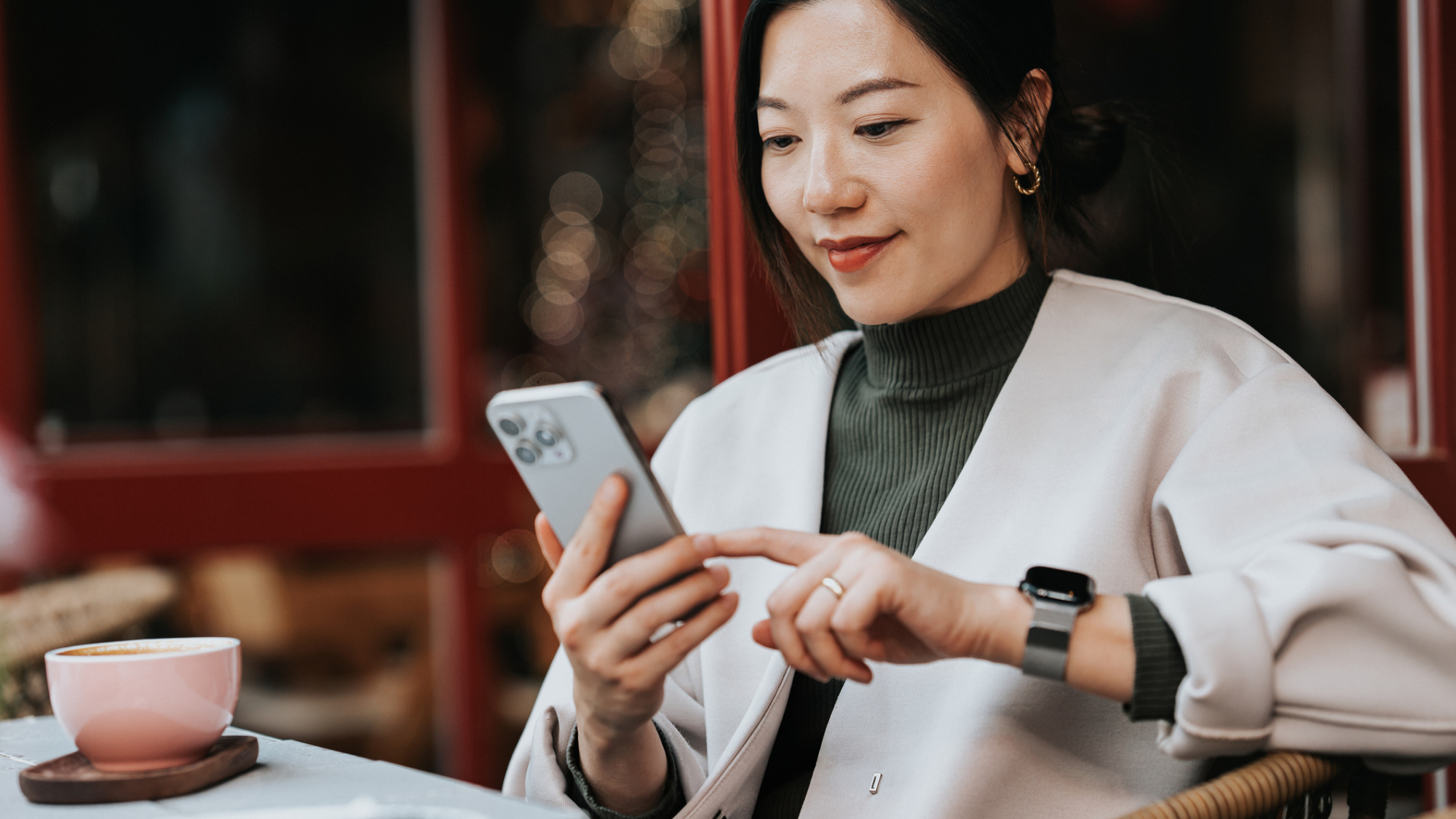 A woman looking at their smartphone.