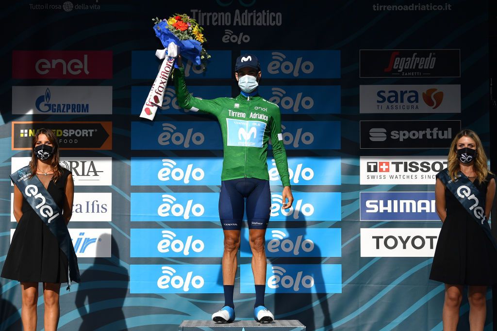 SARNANO ITALY SEPTEMBER 11 Podium Hector Carretero of Spain and Movistar Team Green Mountain Jersey Celebration Flowers Mask Covid safety measures during the 55th TirrenoAdriatico 2020 Stage 5 a 202km stage from Norcia to SarnanoSassotetto 1335m TirrenAdriatico on September 11 2020 in Sarnano Italy Photo by Justin SetterfieldGetty Images