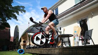 Tom Wood, the Northampton Saints and England back row forward, works out in his garden, using a Wattbike on May 18, 2020