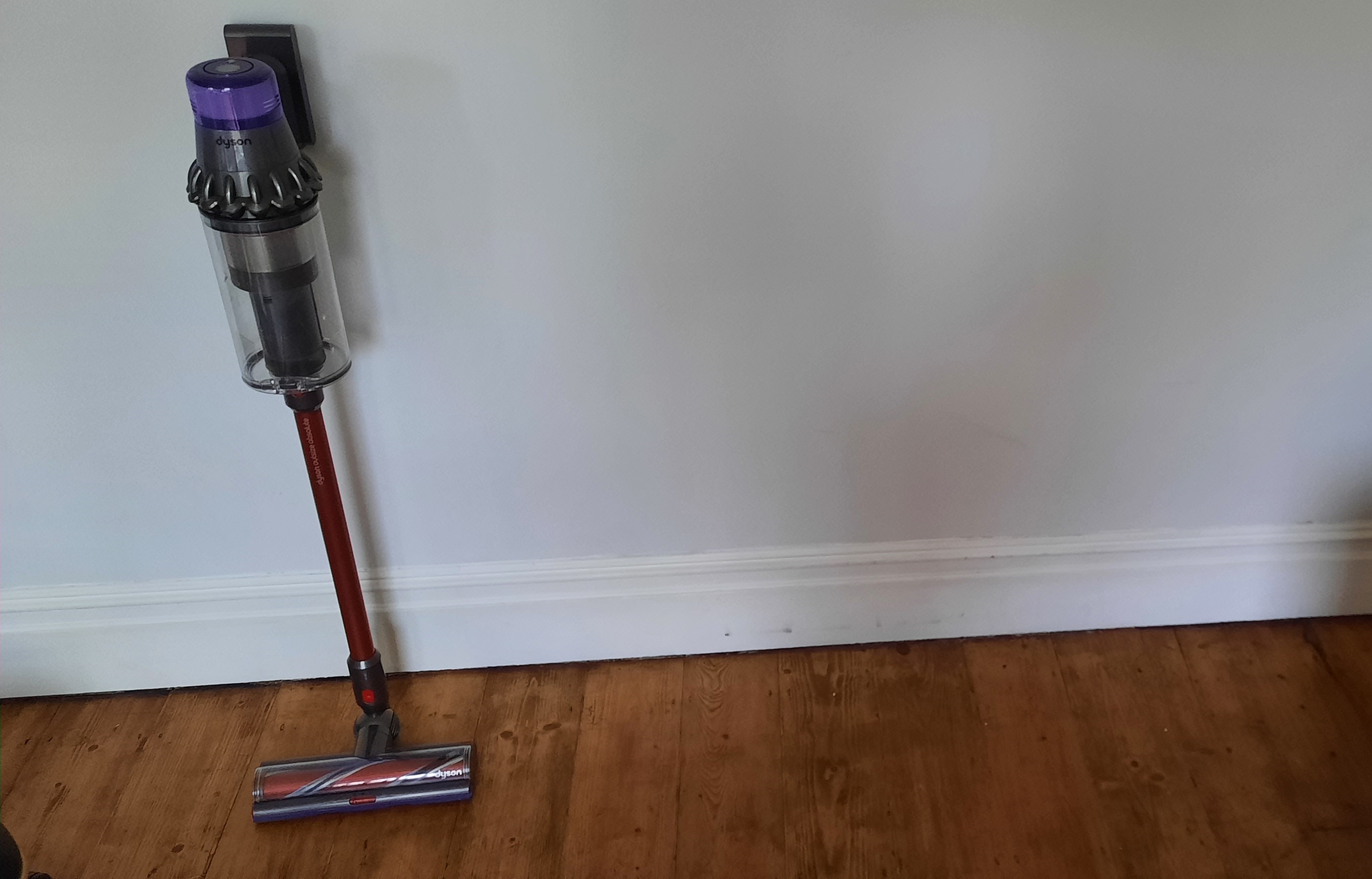 dyson v11 outsize stood next to the wall