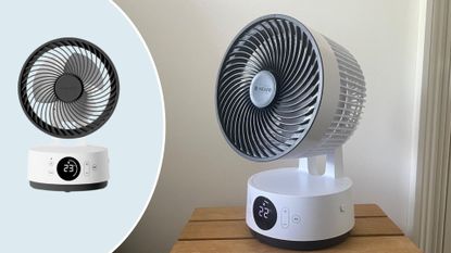 The Meaco Sefte 6 Inch Portable Fan on a table next to a bed with a blue semicircle with a cutout of the Meaco Sefte 6 Inch Portable Fan in