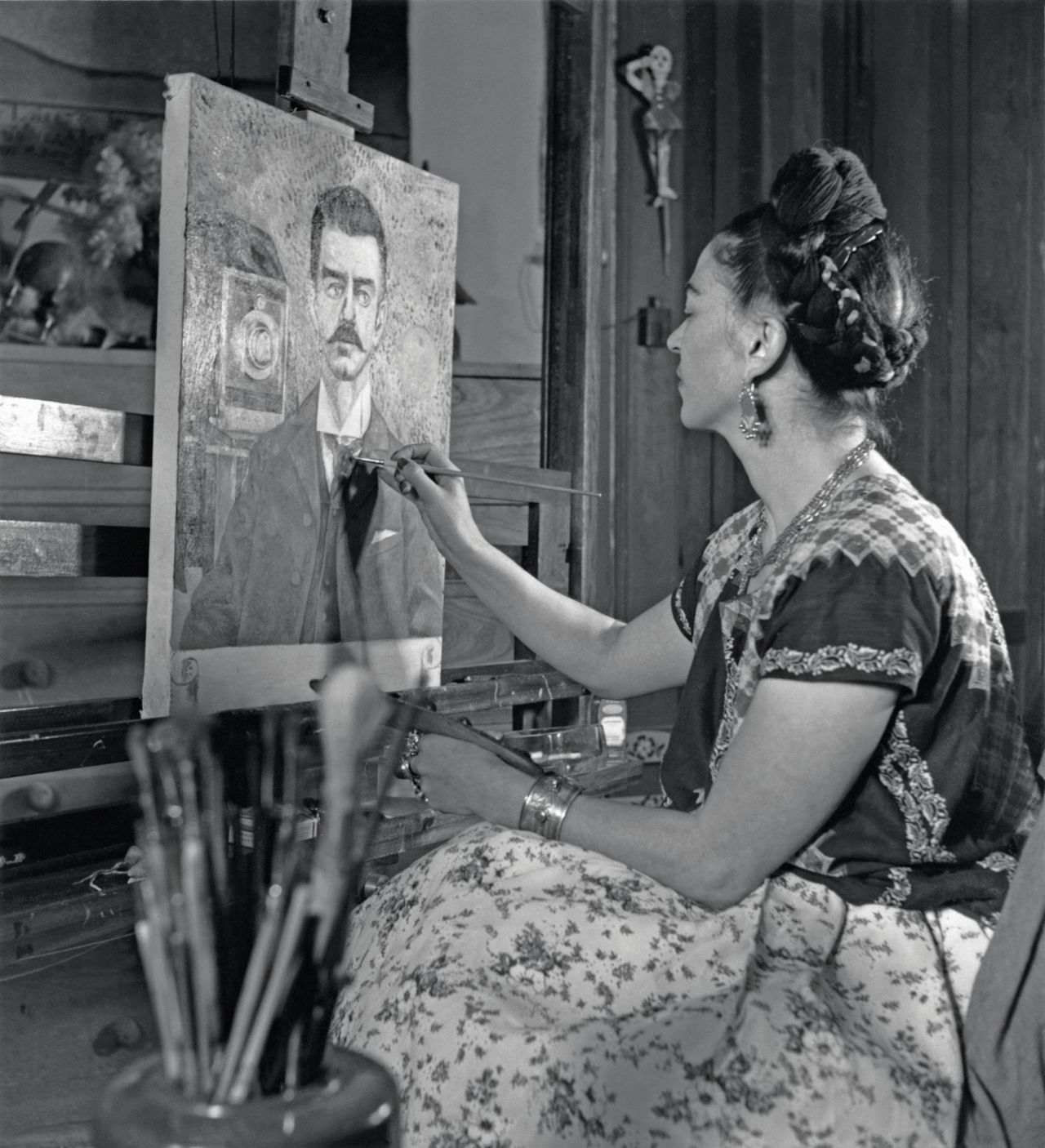 Frida Kahlo pictured at work in 1952.