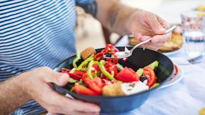 Man eating a healthy salad bowl