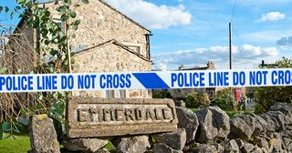 Emmerdale police tape across the village. 